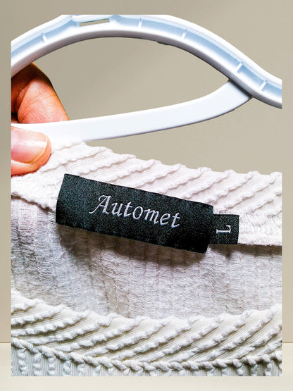 Automet brand tag showing size L