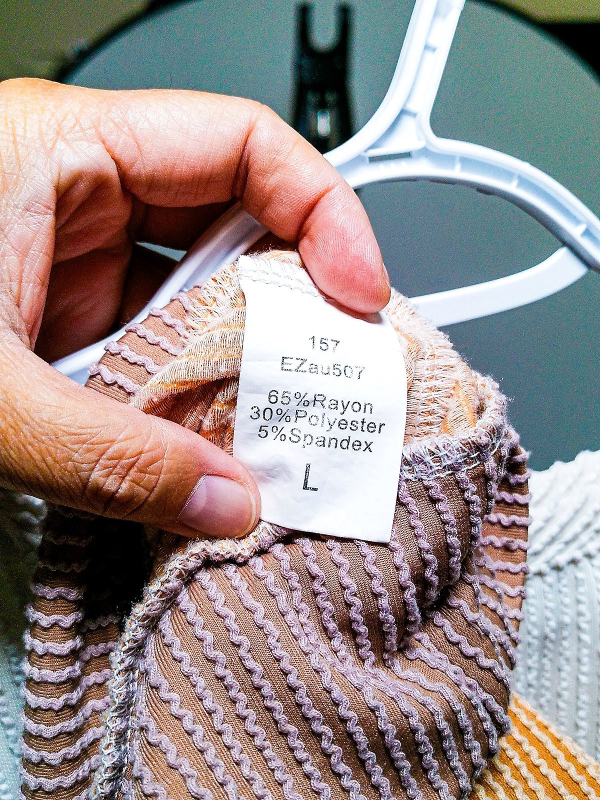 Fabric content tag showing 65% Rayon, 30% Polyester, 5% Spandex, size L