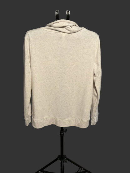 A light beige heathered long-sleeve hoodie with a cowl neck, displayed on a black mannequin stand against a gray circular studio backdrop.