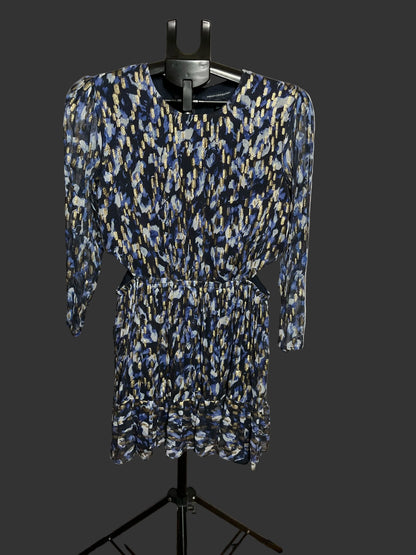A long-sleeve mini dress with a blue, beige, and white abstract pattern, displayed on a black hanger stand against a white circular studio backdrop.