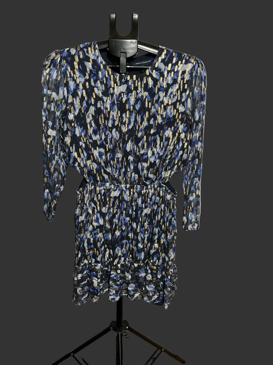 A long-sleeve mini dress with a blue, beige, and white abstract pattern, displayed on a black hanger stand against a white circular studio backdrop.
