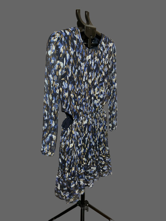A long-sleeve ruffled dress with an abstract blue, white, and black pattern, displayed on a black dress form against a white studio backdrop.