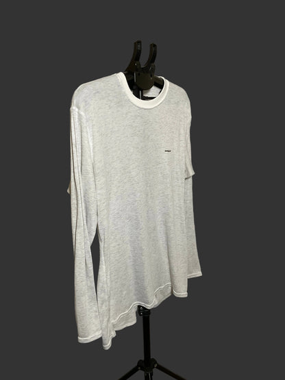 A light gray heather long-sleeve t-shirt with a white crew neck collar, displayed on a black mannequin torso against a dark gray background.