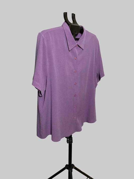 A lavender purple short-sleeve button-up shirt displayed on a black dress form mannequin against a solid gray background.