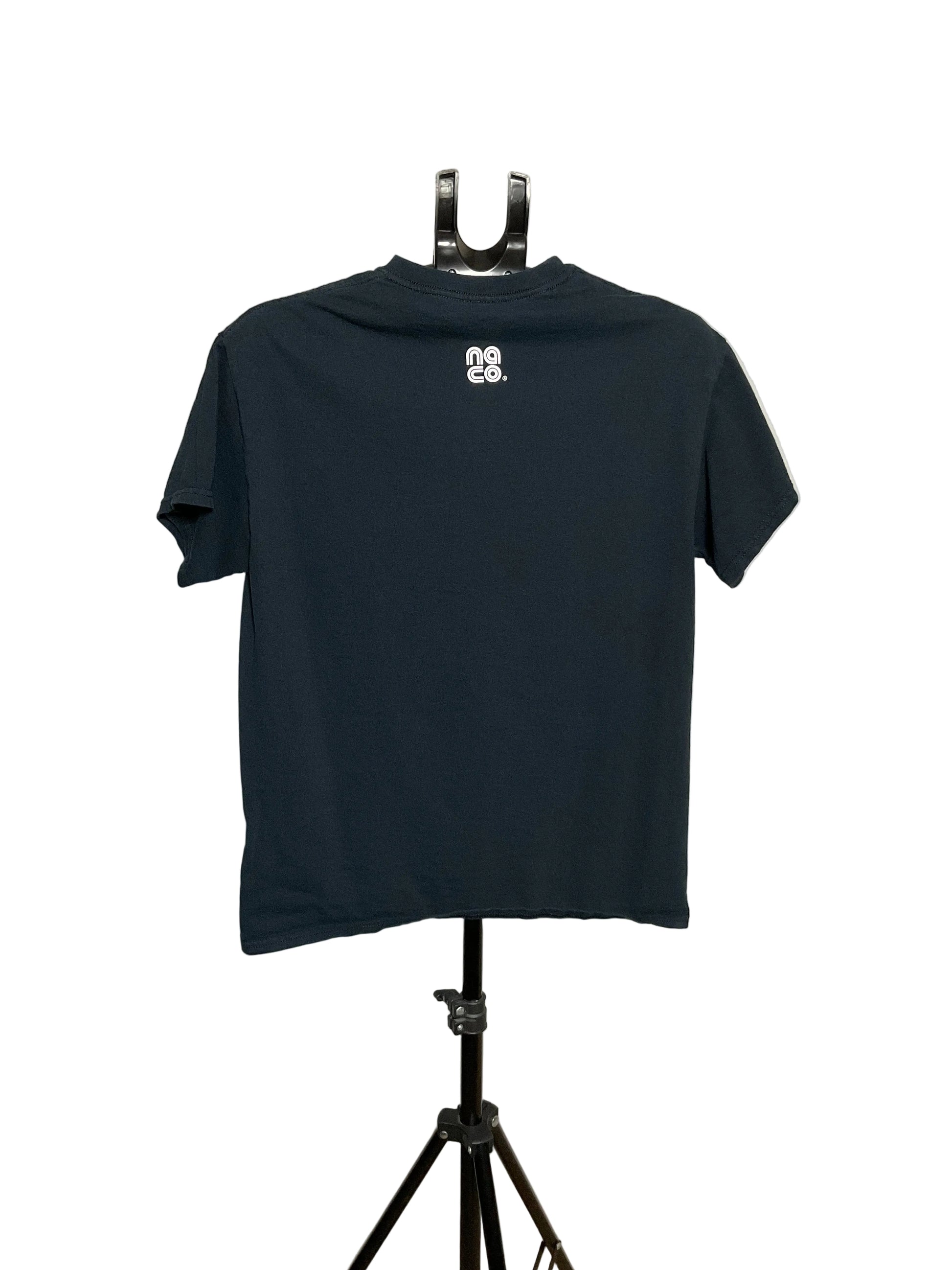 A dark navy blue short-sleeve t-shirt displayed on a black hanger stand against a white circular studio backdrop. The back of the shirt features a small white graphic logo near the upper center.