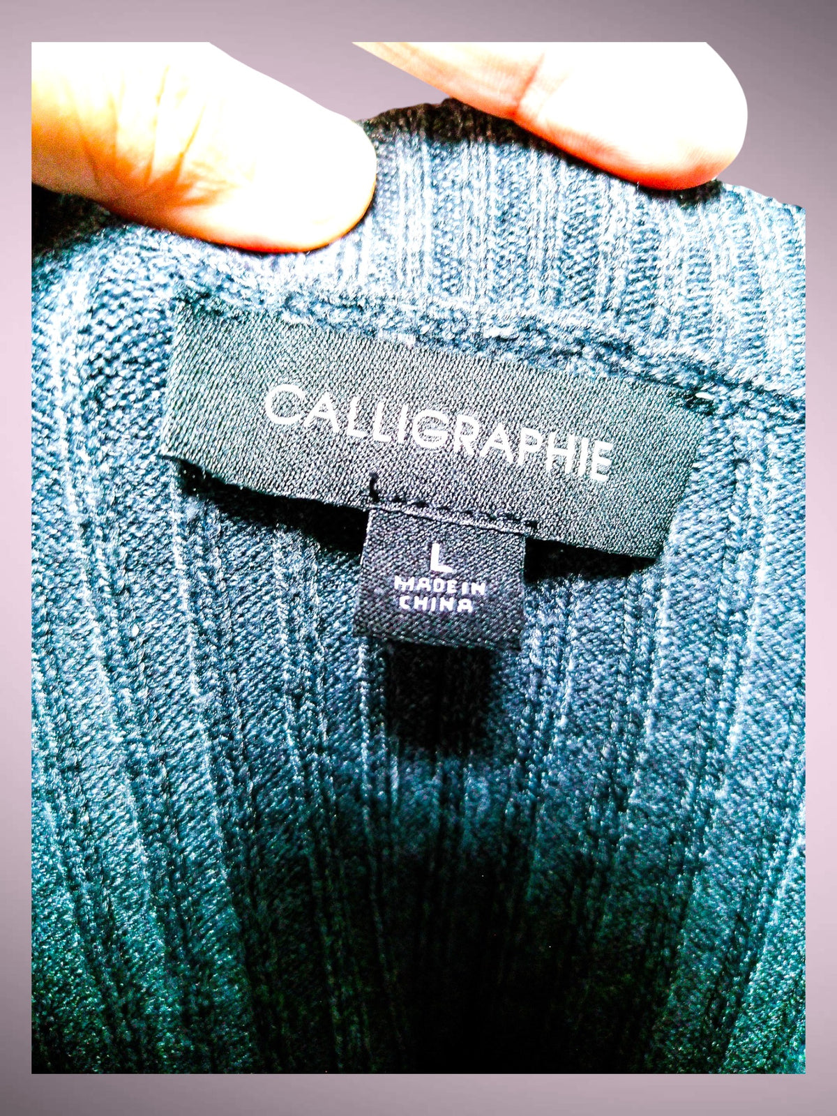 Calligraphy sweater size L and Made in China label