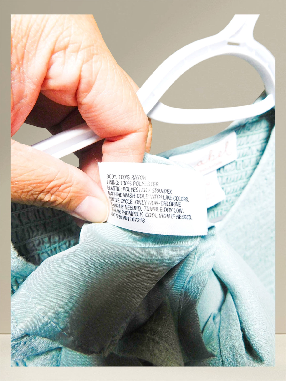 Care label showing 100% rayon body and 100% polyester lining