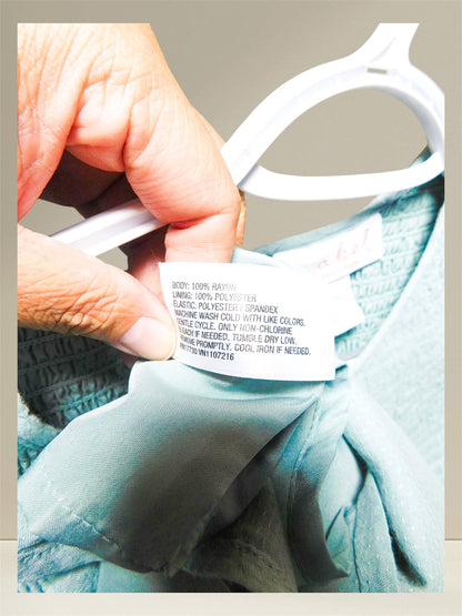 Care label showing 100% rayon body and 100% polyester lining
