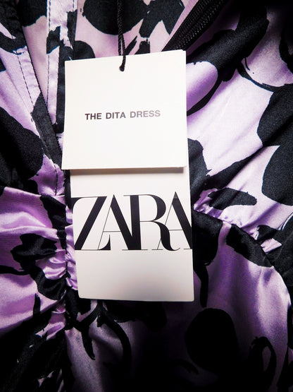 Zara hang tag identifying The Dita Dress