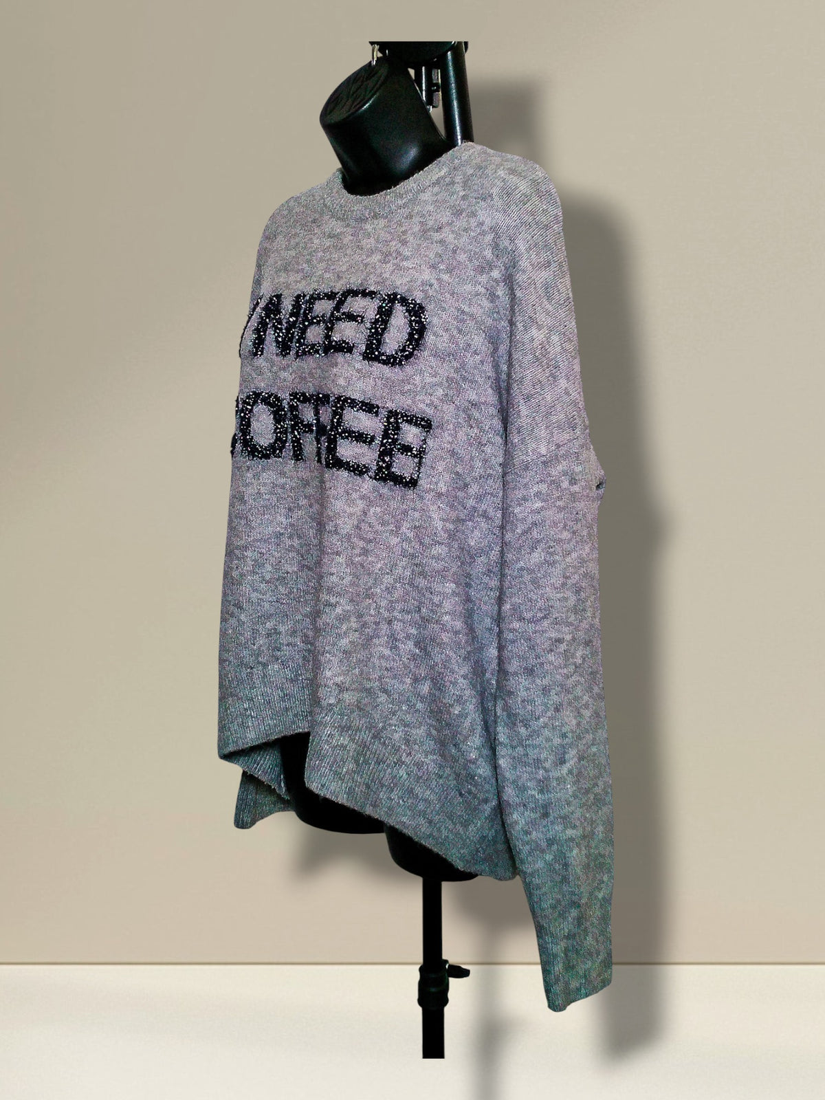 Opposite angled view showing sparkling I Need Coffee lettering