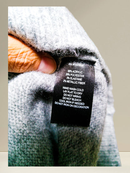 Fabric and care label showing acrylic polyester elastane and metallic fiber blend