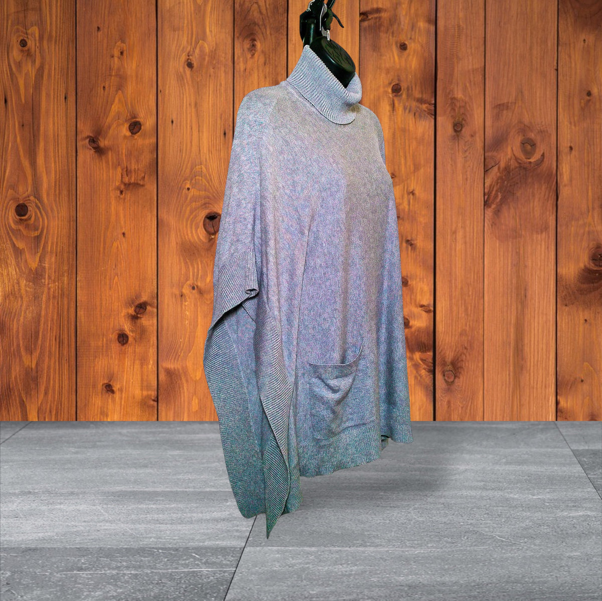 Angled view of gray turtleneck poncho