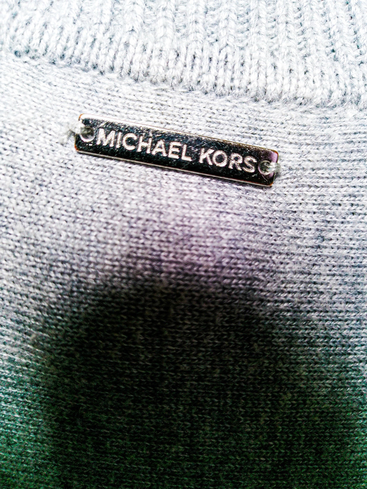 Michael Kors metal logo detail