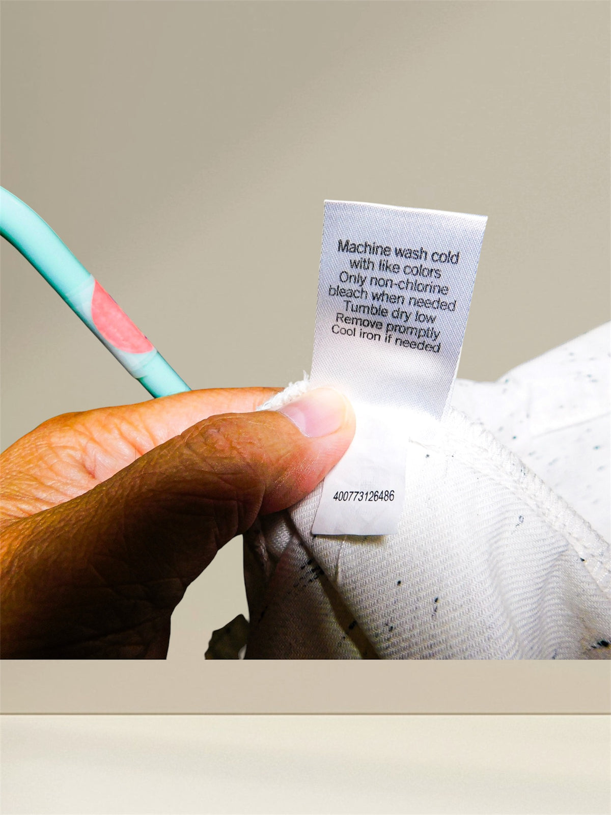 Care instructions label closeup with barcode 400773126486