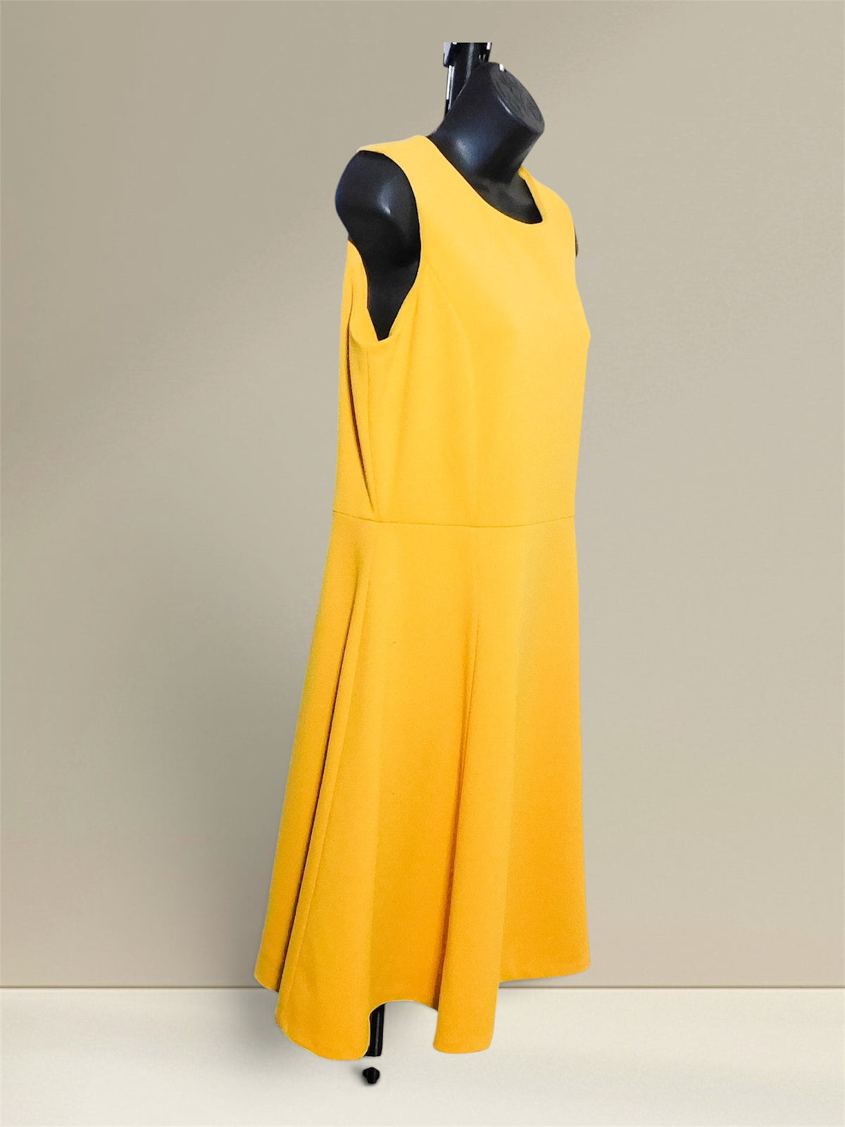 Calvin Klein yellow fit and flare dress, side view